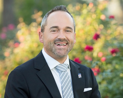 Councilmember Stuart Hene headshot in the Tyler Rose Garden